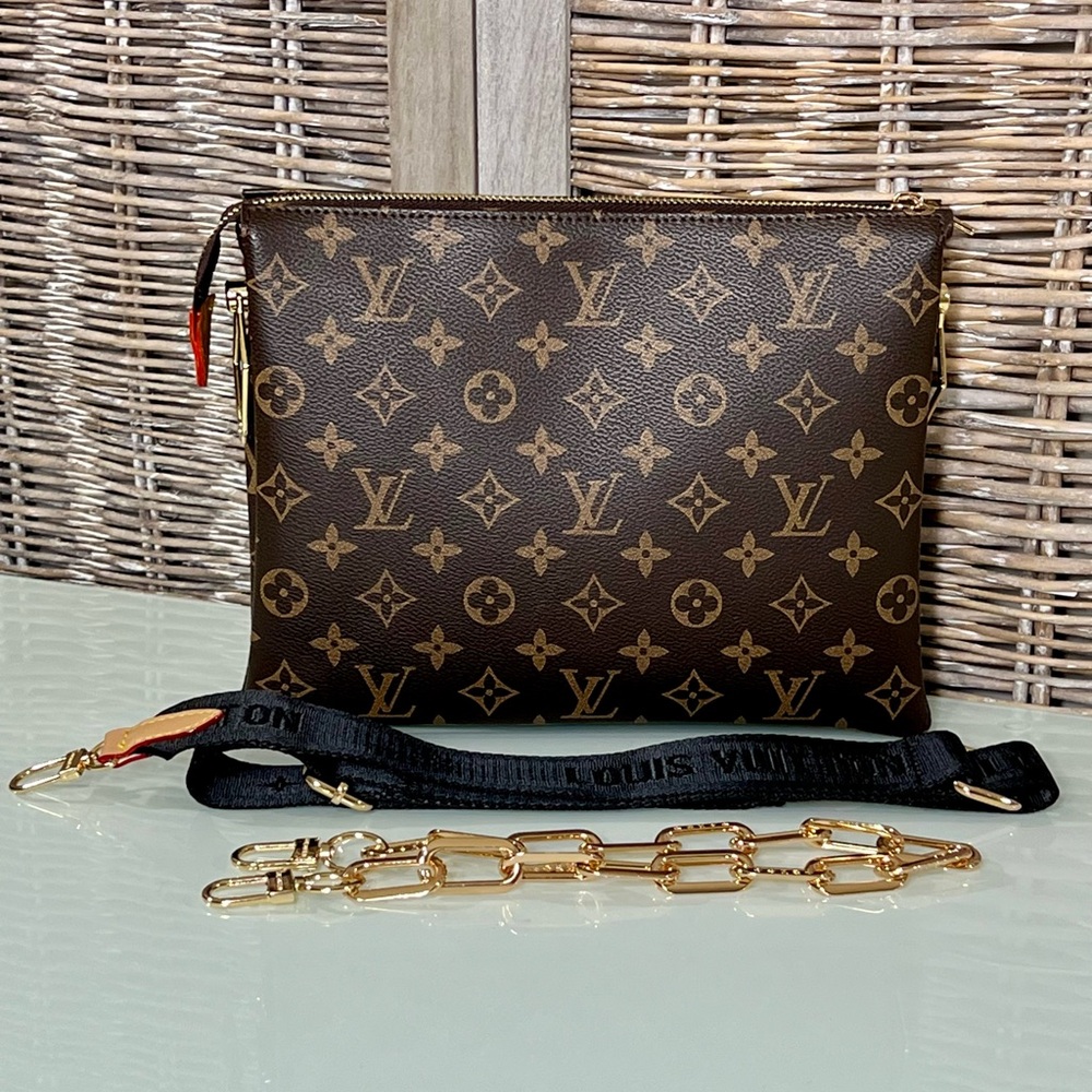 Timeless luxury and intuitive design. Brown leather bag. Textile & chain strap.